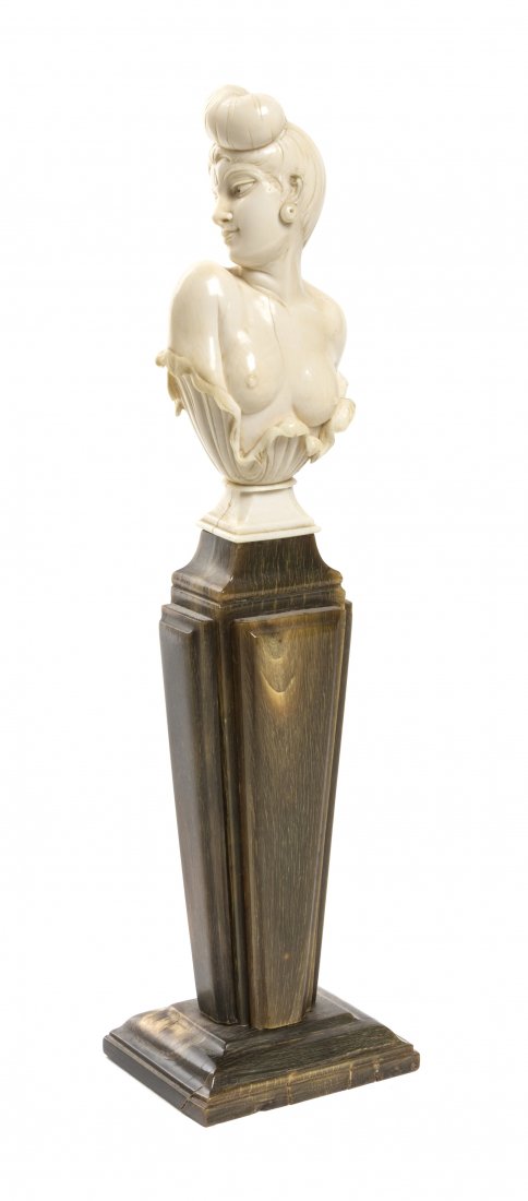 A Continental Carved Ivory Bust, Height overall 9: A Continental Carved Ivory Bust, depicting a nude maiden raised on a bone veneered pedestal. Height overall 9 5/8 inches. Property from the Estate of Mr. Mark Fritz, West Bloomfield, Michigan