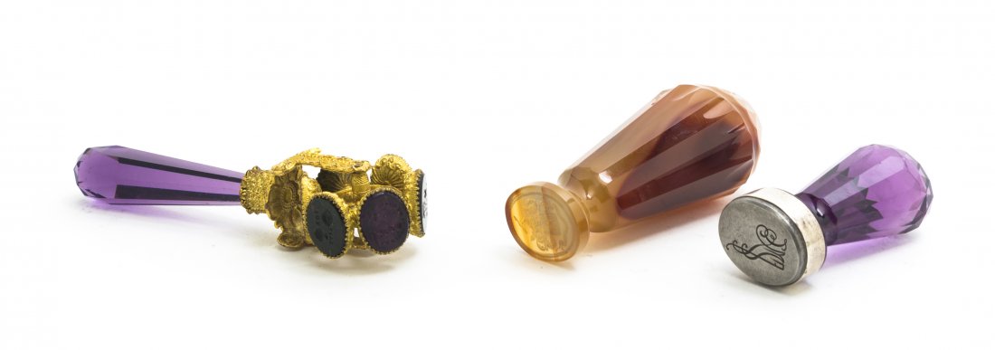 A Continental Revolving Seal, Height of first 4 i: A Continental Revolving Seal, having a faceted glass handle with six revolving intaglio seals, together with two other faceted seals. Height of first 4 inches. Property from the Estate of Mr. Mark Fri