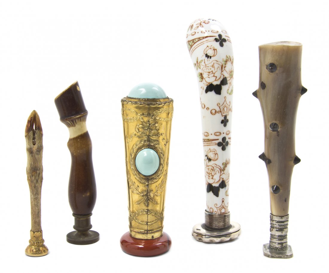 A Collection of Five Continental Seals, Height of: A Collection of Five Continental Seals, of various forms and materials, including gilt metal, porcelain, a taxidermy animal leg and others. Height of tallest 4 3/4 inches. Property from the Estate of
