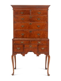 A Queen Anne Figured and Veneered Walnut Flat-Top High Chest Of Drawers