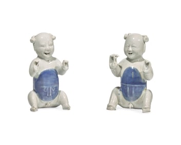 A Pair Of Chinese Porcelain Laughing Boys In Blue And White