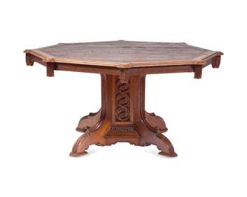 A Gothic Revival Carved Oak Center Table With Inset Leather Top