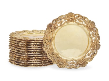 A Set Of Fourteen Gilt Sterling Silver Floral Cast And Reticulated Dinner Plates
