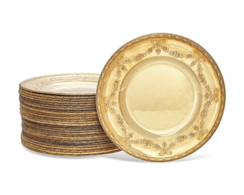 A Set Of Twenty-Nine French Louis XVI Style Silver-Gilt Repousse Dinner Plates