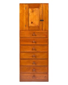 A Shaker Pine Cupboard Over Seven Drawers