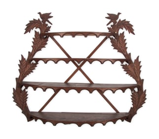 A Folk Art Carved Walnut Figural Wall Shelf
