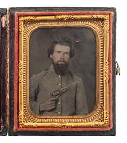 [CIVIL WAR]. Ninth plate ruby ambrotype of Confederate cavalryman holding a Whitney Revolver, with p