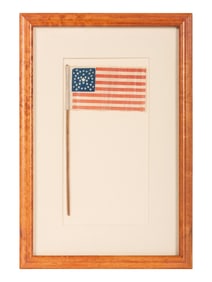 [FLAGS]. 36-star American parade flag in a rare "Great-Star-in-a-Wreath" pattern. Ca 1865-1867.