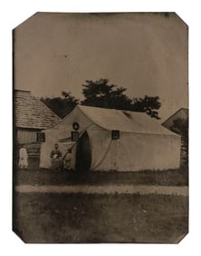 [EARLY PHOTOGRAPHY]. Tintype featuring a photographer's tent with example images displayed on the