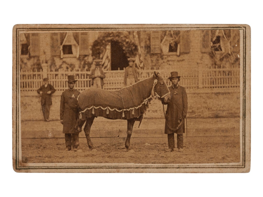 [LINCOLN, Abraham (1860-1865)]. CDV of Lincoln's Horse, "Old Robin" led by African American Reverend: [LINCOLN, Abraham (1860-1865)]. CDV of Lincoln's Horse, "Old Robin" led by African American Reverend Henry Brown at the funeral. Springfield, IL: F.W. Ingmire, [4 May 1865]. CDV on cardstock mount wit