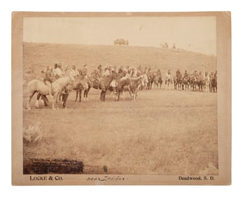 [NATIVE AMERICANS]. Large format photograph of Sioux Indians on horseback, Crow Agency, Montana.