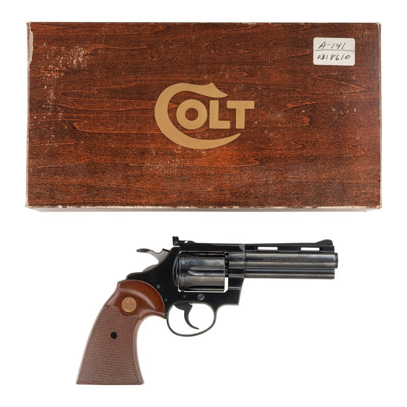 *Colt Diamondback .22 Revolver in Factory Box: *Colt Diamondback .22 Revolver in Factory Box .22LR. 4" ventilated ribbed barrel. SN: R05027 (mfg. ca. 1978). Blued finish, checkered hardwood grips with gold Rampant Colt medallions. Double action re