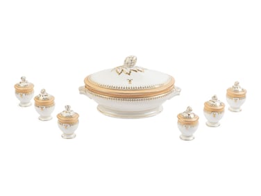 A Limoges porcelain buff-ground tureen and cover together with 6 matching pots de crème with