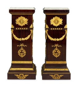 A Pair of Monumental Empire Style Gilt Bronze Mounted Mahogany Pedestals