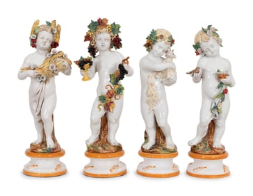 A Set of Large Italian Majolica Four Seasons Putti Figures