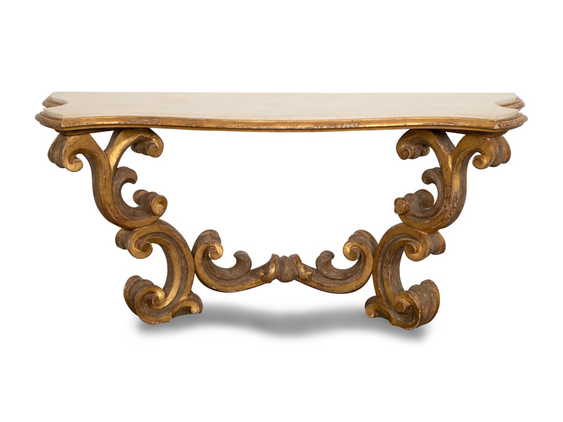 A Dennis and Leen Baroque Giltwood Console with Limestone Top: A Dennis and Leen Baroque Giltwood Console with Limestone Top 20th Century Wall-mounted. Height 36 x width 76 x depth 25 inches. This lot is located in Palm Beach.