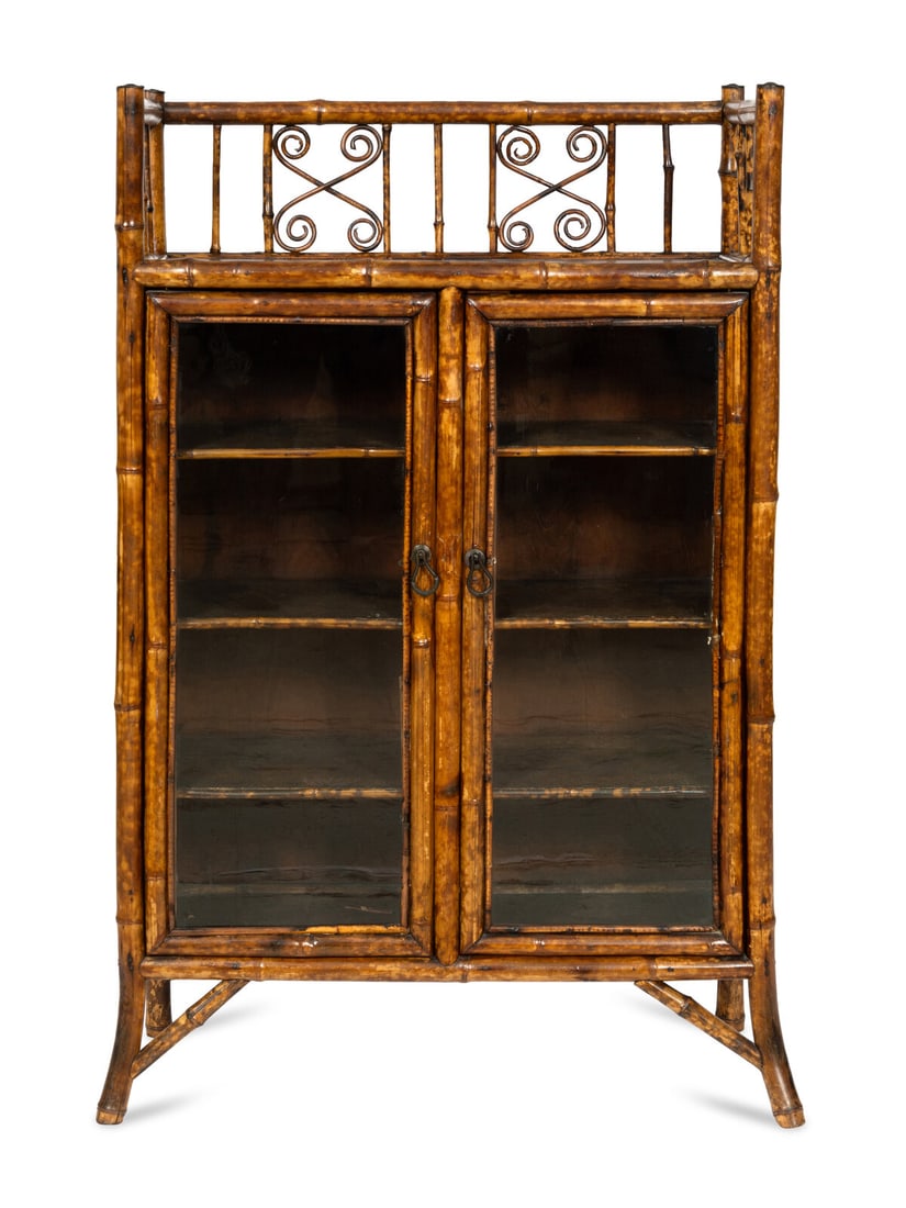 An Edwardian Bamboo and Japanese Lacquer Bookcase: An Edwardian Bamboo and Japanese Lacquer Bookcase Manner of Jean-Baptiste Kohn, London, Circa 1910 With lacquer panels and embossed paper. Height 48 1/2 x width 30 1/2 x depth 13 inches. This lot is l