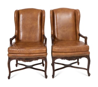 A Pair of Régence Style Leather-Upholstered Wingback Chairs