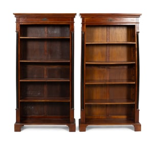 A Pair of Empire Style Parcel Ebonzied Mahogany Bookcases