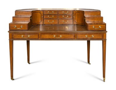 A Baker Satinwood and Rosewood 1765 Carlton House Desk: A Baker Satinwood and Rosewood 1765 Carlton House Desk 20th Century with embossed leather writing surface. Height 38 1/2 x width 54 x depth 29 inches. Bearing a Limited Edition Baker Furniture brass p