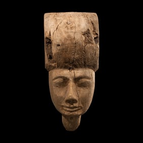 An Egyptian Wood Sarcophagus Mask