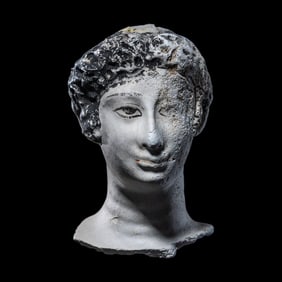 An Egyptian Painted Stucco Mummy Mask