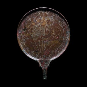 An Etruscan Bronze Mirror with Incised Scene of Hercules and Apollo
