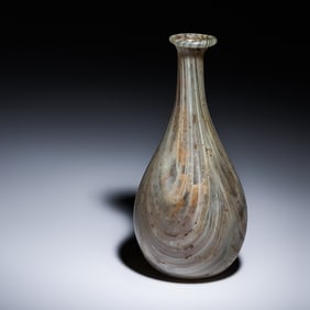 A Roman Marbled Pale Green and White Glass Bottle