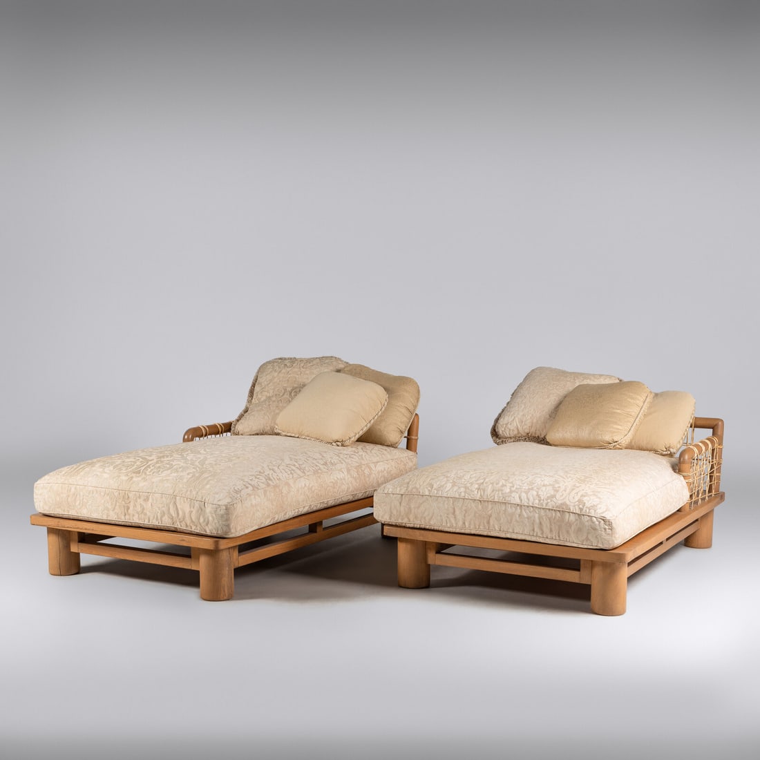 Karl Springer (German-American, 1931–1991) Pair of dowel-wood chaises: Karl Springer (German-American, 1931–1991) Pair of dowel-wood chaises oak, rawhide straps, upholstery 26 h × 44 w × 68 d in (66 × 112 × 173 cm) This lot is located in Chicago