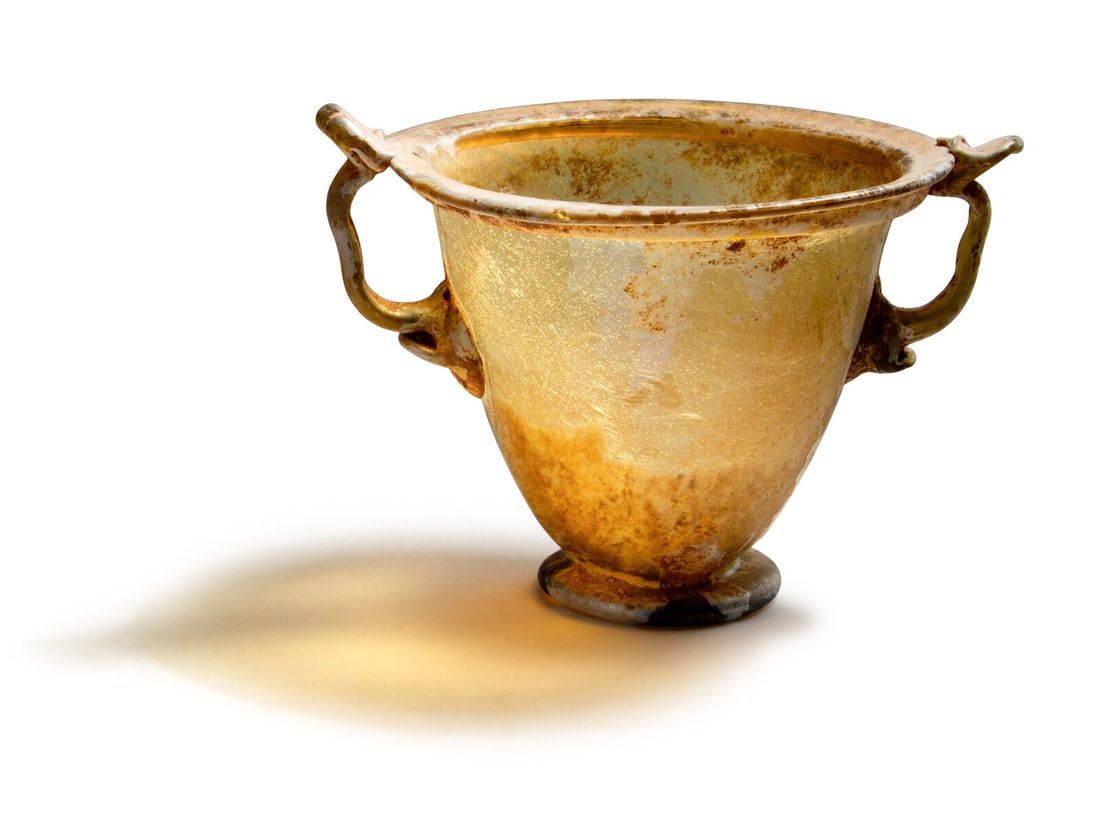 A Roman Yellow Glass Skyphos: A Roman Yellow Glass Skyphos Circa 2nd Century A.D. Width 4 7/8 inches (12.38 cm). Property from a Private Michigan Collection This lot is located in Chicago. Provenance: Fortuna Fine Arts, Ltd., New 