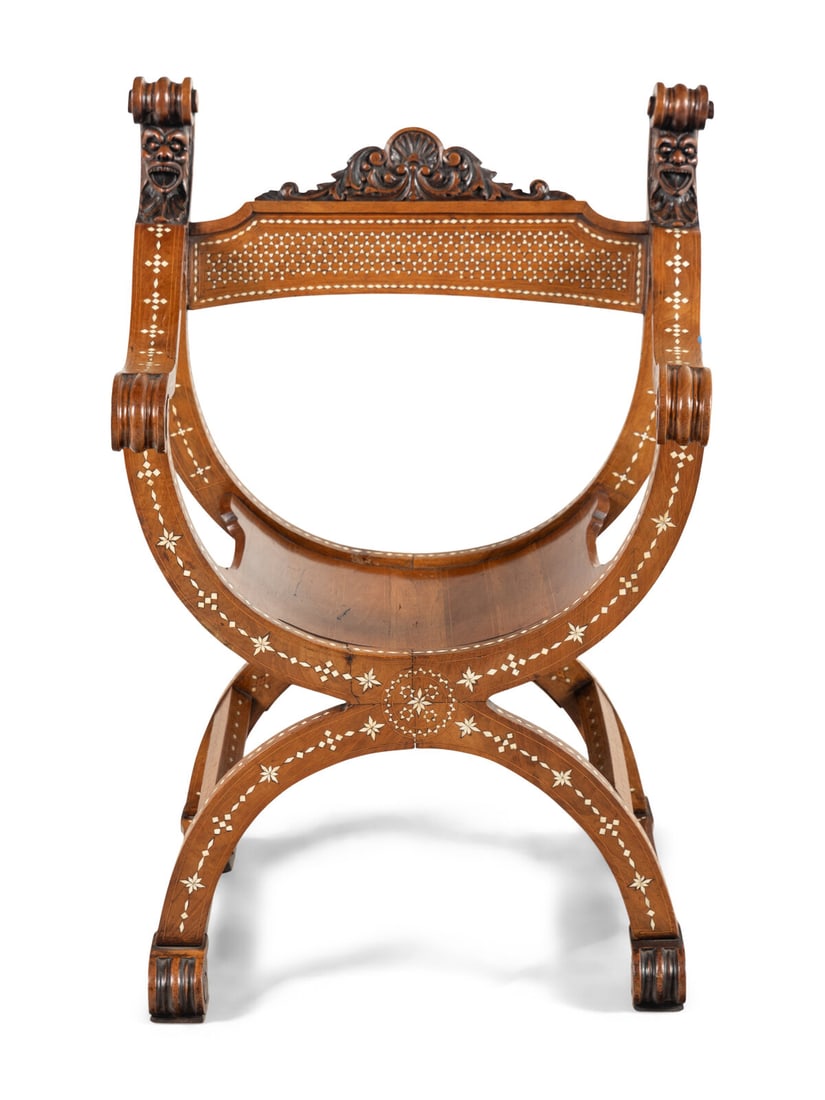 A North Italian Carved Walnut and Bone-Inlaid Savonarola Chair: A North Italian Carved Walnut and Bone-Inlaid Savonarola Chair Milan, Mid-19th Century Height 33 1/2 x width 22 1/4 x depth 18 inches. This lot is located in Chicago.