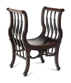 An American Victorian Carved Curule Chair