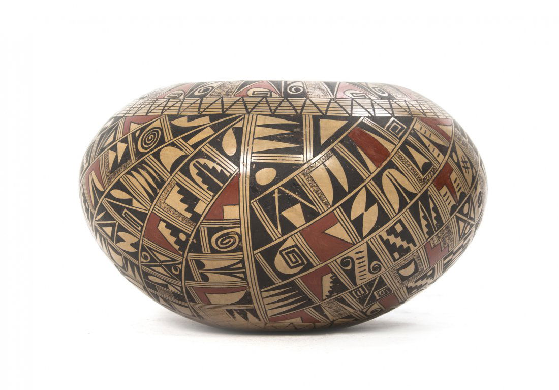 A Hopi-Tewa Polychrome Vessel, Rondina Huma, Height 4 3: A Hopi-Tewa Polychrome Vessel, Rondina Huma, of squat ovoid form with repeating geometric decoration throughout, signed Rondina Huma, Tewa, Polacca, AZ. Height 4 3/4 x diameter 8 inches.