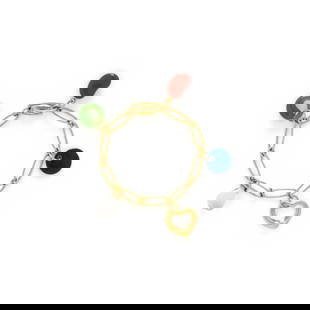 TIFFANY & CO., ELSA PERETTI, CHARM BRACELET: TIFFANY & CO., ELSA PERETTI, CHARM BRACELET Five charms including a red jasper Bean, jade Eternal Circle, rock crystal Teardrop, lapis round pendant, and yellow gold Open Heart, on a fancy link ch
