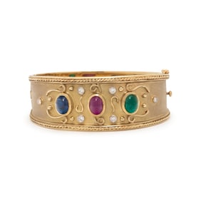 BRUSHED YELLOW GOLD, RUBY, EMERALD, SAPPHIRE, AND DIAMOND BANGLE BRACELET