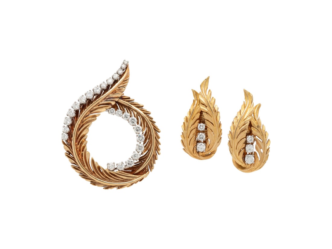 MCTEIGUE, YELLOW GOLD AND DIAMOND BROOCH AND EARRINGS: MCTEIGUE, YELLOW GOLD AND DIAMOND BROOCH AND EARRINGS Round diamonds weighing approximately 1.50 carats total. 18 karat yellow gold and platinum. Brooch: 1 1/4 x 1 1/2 inches. Earrings: 1 inch long. E