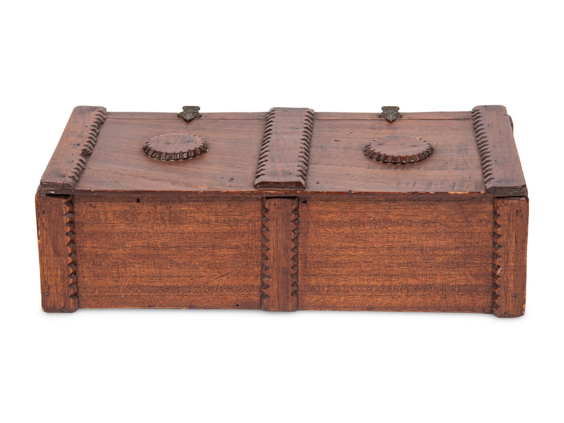 A Hardwood Table Casket: A Hardwood Table Casket 20th Century Height 4 x width 13 x depth 6 1/2 inches. Property from the Estate of James G. Hansen at Fetcher House, Winnetka, Illinois This lot is located in Chicago. The Fetc
