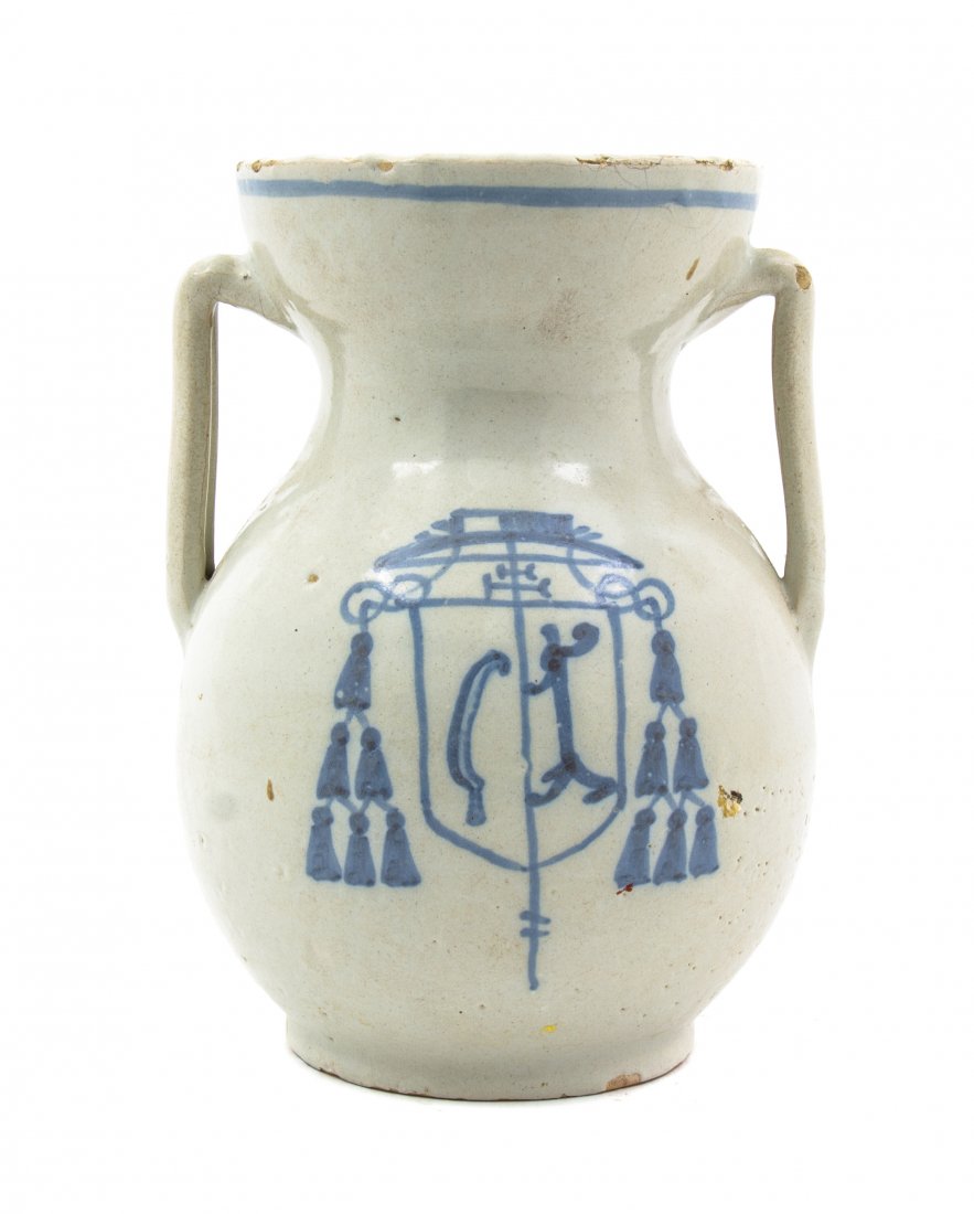 A Continental Faience Jug, Height 9 inches.: A Continental Faience Jug, of baluster form with applied handles and armorial crest decoration. Height 9 inches. Property from the Collection of Mr. and Mrs. William E. Benjamin II, Manalapan, Florida