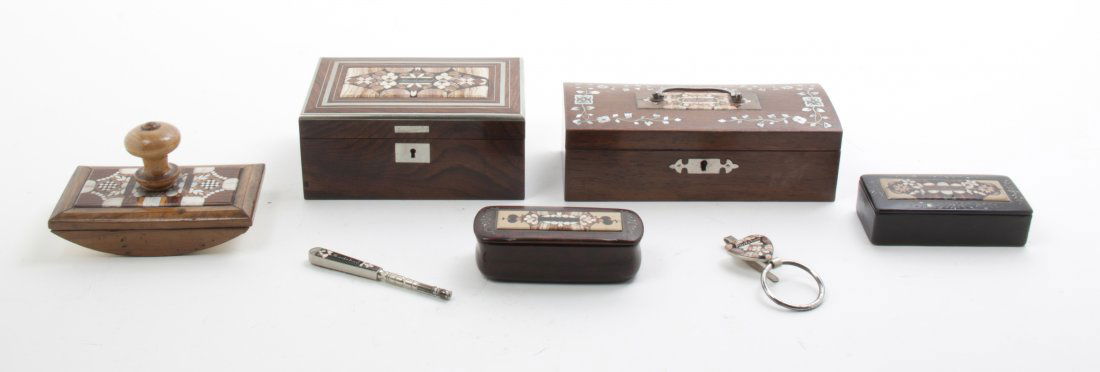 A Collection of Stone Inset Articles, Width of widest 7: A Collection of Stone Inset Articles, comprising three boxes, a rocker blotter, a keychain and a handle, together with a stone and mother-of-pearl inset box. Width of widest 7 1/2 inches. Property fro