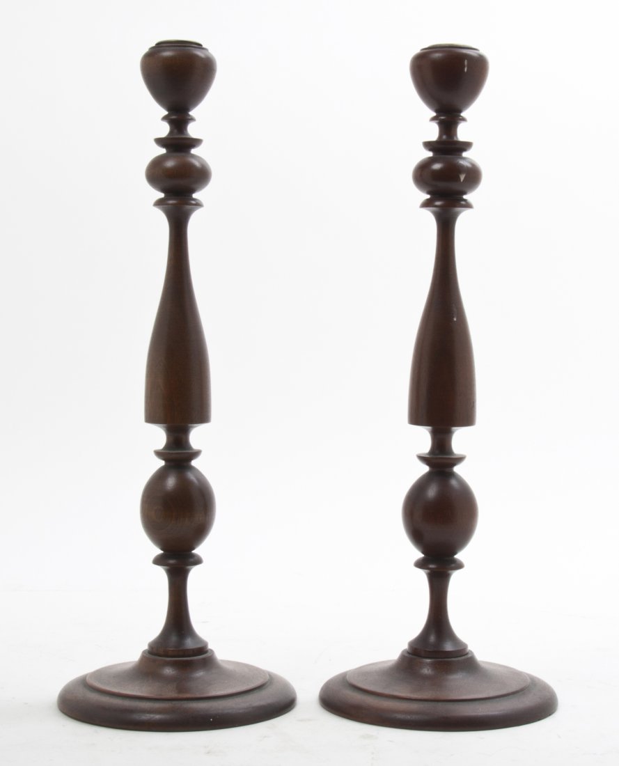 A Pair of Turned Wood Candlesticks, Height 16 1/4 inche: A Pair of Turned Wood Candlesticks, each of baluster form raised on a circular foot. Height 16 1/4 inches. Property from the Estate of Mr. Mark Fritz, West Bloomfield, Michigan