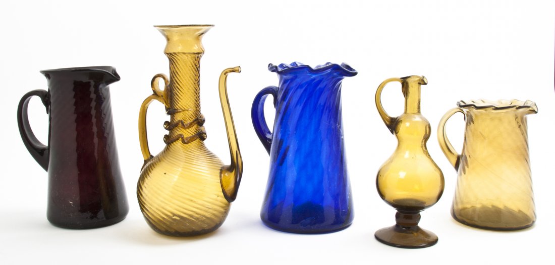 A Collection of Five Colored Glass Vessels, Height of t: A Collection of Five Colored Glass Vessels, of various sizes and forms, each with an applied handle. Height of tallest 11 3/4 inches. Property from the Estate of Mr. Mark Fritz, West Bloomfield, Michi