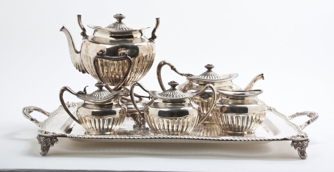 An American Silverplate Tea Service, Gorham, Width of t: An American Silverplate Tea Service, Gorham, comprising a teapot and kettle on stand with ivory insulators, a covered sugar, a creamer and an associated silverplate tray. Width of tray 25 3/8 inches. 