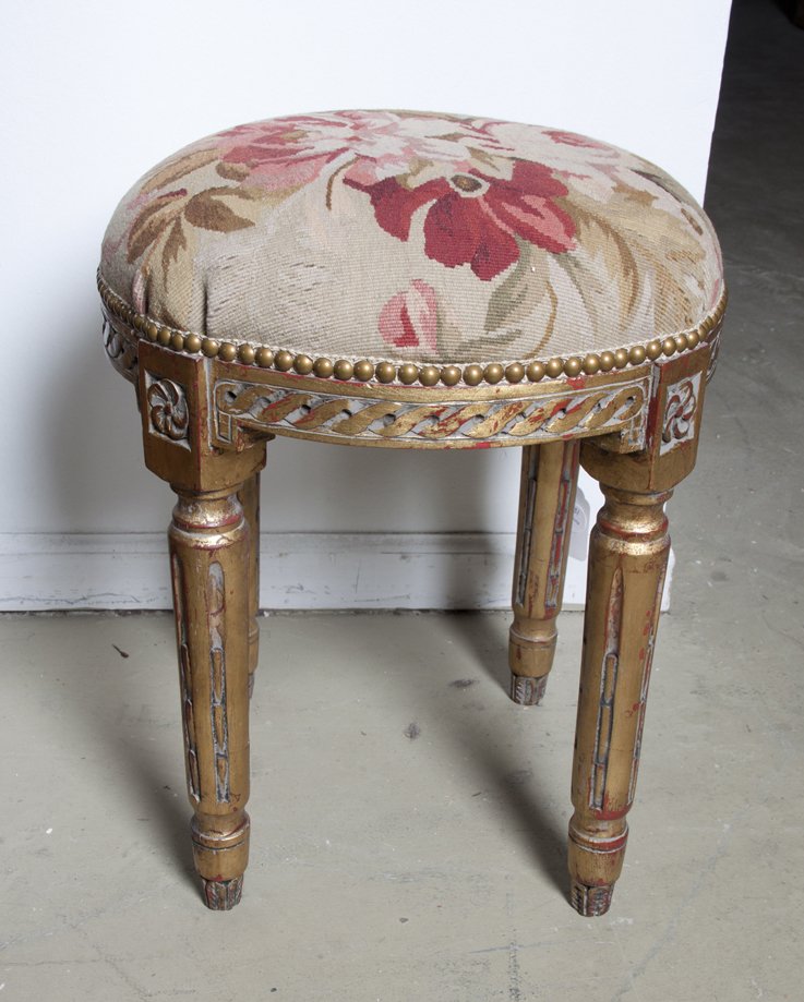 A Louis XVI Style Giltwood Tabouret, Height 19 x width: A Louis XVI Style Giltwood Tabouret, a circular aubusson upholstered seat, set on a conforming frame, raised on tapering fluted legs. Height 19 x width 16 inches. Property from the Collection of Dr. a