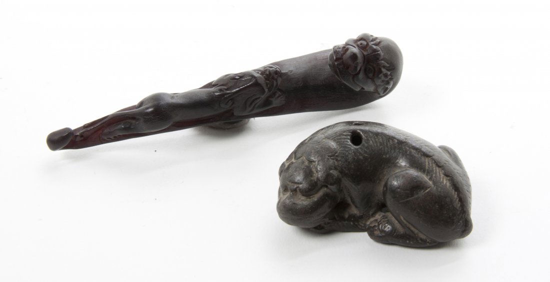 A Carved Wood Belt Hook, Length of longest 4 inches.: A Carved Wood Belt Hook, together with a carved scroll weight. Length of longest 4 inches.