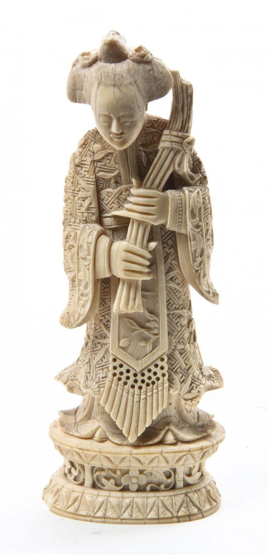 A Carved Ivory Figure of a Woman, Height 5 1/2 inches.: A Carved Ivory Figure of a Woman, depicted in an intricately decorated robe, the whole set on a conforming stand. Height 5 1/2 inches.