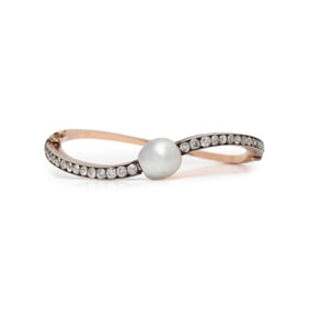EDWARDIAN, NATURAL PEARL AND DIAMOND BANGLE BRACELET