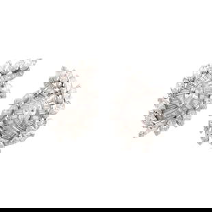 DIAMOND AND PLATINUM EARRINGS: DIAMOND AND PLATINUM EARRINGS Set with marquise and baguette cut diamonds weighing approximately 9.00 carats total. Mounted in platinum with white gold clip backs. 1 1/4 inches long. Gross weight: 13.