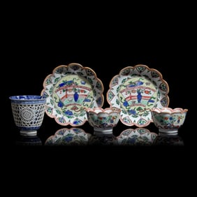 A Chinese Reticulated Blue and White Porcelain Wine Cup and Two Famille Verte Tea Bowls with Saucers