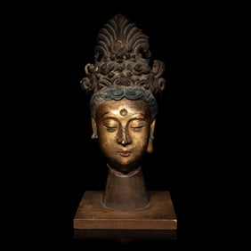 A Chinese Polychrome Painted Stucco Head of a Female Attendant, Song-Ming Dynasty 宋-明