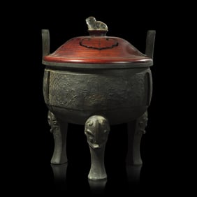 A large Chinese patinated bronze archaistic tripod censer, Ding, and wood cover, The Bronze 17th/18t